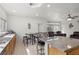 Bright kitchen features granite countertops, stainless steel sink, and eat-in seating with wrought iron stools at 1077 Las Palmas Entrada Ave, Henderson, NV 89012