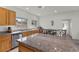 Bright kitchen features granite countertops, stainless steel sink, and island with eat-in seating at 1077 Las Palmas Entrada Ave, Henderson, NV 89012