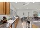 Bright kitchen features granite countertops, stainless steel sink, and eat-in seating with wrought iron stools at 1077 Las Palmas Entrada Ave, Henderson, NV 89012