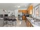 Bright kitchen features stainless steel appliances, granite counters, and an eat-in bar with wrought iron stools at 1077 Las Palmas Entrada Ave, Henderson, NV 89012