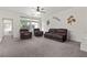 Spacious living room filled with natural light, showcasing modern decor and a comfortable seating area at 1077 Las Palmas Entrada Ave, Henderson, NV 89012