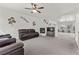 Open-concept living room featuring a fireplace, seamlessly connecting to the kitchen at 1077 Las Palmas Entrada Ave, Henderson, NV 89012