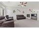 Spacious living room filled with natural light, showcasing modern decor and a comfortable seating area at 1077 Las Palmas Entrada Ave, Henderson, NV 89012
