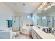 Primary bathroom showcases a tub, standalone shower, and a large vanity at 10900 Calcedonian St, Las Vegas, NV 89141