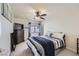 Carpeted bedroom with a dark dresser, tv and a cozy bed at 10900 Calcedonian St, Las Vegas, NV 89141