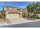 Charming two-story home with a two-car garage and desert landscaping, offering curb appeal at 10900 Calcedonian St, Las Vegas, NV 89141
