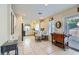 Open-concept kitchen showcasing tiled floors, white cabinets and dining area at 10900 Calcedonian St, Las Vegas, NV 89141