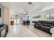 Open-concept living and dining area with recessed lighting and tile flooring, leading to a sliding glass door at 10900 Calcedonian St, Las Vegas, NV 89141