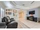 Bright living room featuring tile floors, modern ceiling, and open staircase leading to upper level at 10900 Calcedonian St, Las Vegas, NV 89141