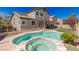 Inviting backyard showcases a sparkling pool, patio, lush landscaping, and ample space for outdoor activities at 11484 Roncat Ct, Las Vegas, NV 89141