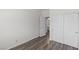 Bedroom with wood floors features an en suite bath and closet with sliding doors at 11484 Roncat Ct, Las Vegas, NV 89141