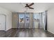 Spacious bedroom with modern ceiling fan, wood-like flooring, and lots of natural light at 11484 Roncat Ct, Las Vegas, NV 89141