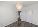 Bedroom with wood floors features a capiz shell chandelier and closet with sliding doors at 11484 Roncat Ct, Las Vegas, NV 89141
