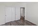 This bedroom features wood floors and a closet with sliding doors at 11484 Roncat Ct, Las Vegas, NV 89141