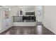 An open concept living room transitions into a modern kitchen at 11484 Roncat Ct, Las Vegas, NV 89141