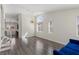 Open-concept living room with lots of natural light and hardwood floors at 11484 Roncat Ct, Las Vegas, NV 89141