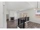 Bright living room with fireplace, hardwood floors, and contemporary lighting at 11484 Roncat Ct, Las Vegas, NV 89141