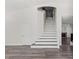 Elegant staircase with hardwood treads and white risers at 11484 Roncat Ct, Las Vegas, NV 89141