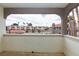 Balcony with views of the rooftops and a community area at 1212 Bass Dr # C, Henderson, NV 89014