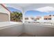 Relaxing balcony view of the community with orange tiled roofs, dedicated covered parking, and mature landscaping at 1212 Bass Dr # C, Henderson, NV 89014