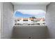 View from the balcony showcasing the well-maintained community buildings with terracotta roofs and dedicated parking spaces at 1212 Bass Dr # C, Henderson, NV 89014