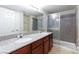 Bathroom with a double sink vanity and glass door shower at 1212 Bass Dr # C, Henderson, NV 89014