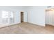 Bedroom with neutral carpet and natural light from patio doors at 1212 Bass Dr # C, Henderson, NV 89014