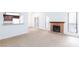 Inviting living room with fireplace, neutral walls, and open to the kitchen and dining area at 1212 Bass Dr # C, Henderson, NV 89014