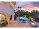 Beautiful backyard oasis with a pool, spa, and outdoor dining area, perfect for entertaining and relaxation at 1212 Muscato Ct, Las Vegas, NV 89144