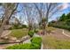 Neighborhood features landscaped walking paths and mature trees at 1212 Muscato Ct, Las Vegas, NV 89144