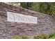 Stone community sign reading 'Vineyards' with manicured landscaping at 1212 Muscato Ct, Las Vegas, NV 89144