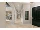 Elegant foyer with high ceilings, marble floors, and an open view of the dining room at 1212 Muscato Ct, Las Vegas, NV 89144