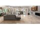 Bright and spacious living room with tile floors, fireplace, and access to outdoor patio at 1212 Muscato Ct, Las Vegas, NV 89144