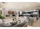 Expansive living area with modern fireplace, large TV, and open layout to the kitchen at 1212 Muscato Ct, Las Vegas, NV 89144