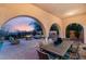Covered patio features an outdoor dining area, fire pit, and lounge seating at 1212 Muscato Ct, Las Vegas, NV 89144
