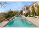 Resort-style backyard with a sparkling pool, cascading water features, and a relaxing spa at 1212 Muscato Ct, Las Vegas, NV 89144