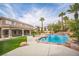 Large backyard with pool, waterfall, patio, and mature tropical landscaping at 1304 Husson Ct, Las Vegas, NV 89142