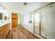 Bright bathroom with double sinks, soaking tub, separate shower, and a large walk-in closet at 1304 Husson Ct, Las Vegas, NV 89142