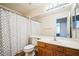 This bathroom features a shower-tub combination and a single sink vanity with wood cabinets at 1304 Husson Ct, Las Vegas, NV 89142
