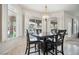 Sunny dining area with backyard and pool views through large windows at 1304 Husson Ct, Las Vegas, NV 89142