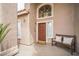 Inviting front entrance featuring a bench, and a decorative window above the solid wood door at 1304 Husson Ct, Las Vegas, NV 89142