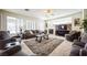 Comfortable living room with fireplace, plush seating, and plenty of natural light from large windows at 1304 Husson Ct, Las Vegas, NV 89142