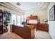 Well-lit home office with a modern desk, built-in cabinets, and a large window at 1304 Husson Ct, Las Vegas, NV 89142