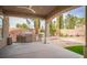 Covered outdoor kitchen area with grill and storage cabinets at 1304 Husson Ct, Las Vegas, NV 89142