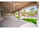 Large covered patio overlooking the pool and backyard with multiple ceiling fans at 1304 Husson Ct, Las Vegas, NV 89142