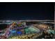 Spectacular aerial view of Topgolf Las Vegas highlighting its vibrant colors and surrounding cityscape at night at 135 Harmon Ave # 3220, Las Vegas, NV 89109