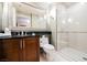 Modern bathroom with a sleek vanity, granite counters, and a glass-enclosed shower providing a spa-like experience at 135 Harmon Ave # 3220, Las Vegas, NV 89109