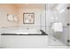 Bathroom showcasing the jetted tub with elegant fixtures and glass enclosed walk-in shower at 135 Harmon Ave # 3220, Las Vegas, NV 89109