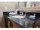 Elegant bathroom featuring a granite countertop, stylish mirror, and ample lighting for a luxurious experience at 135 Harmon Ave # 3220, Las Vegas, NV 89109