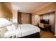 Comfortable bedroom with soft lighting, curtains, desk, and a luxurious king-sized bed, perfect for unwinding at 135 Harmon Ave # 3220, Las Vegas, NV 89109